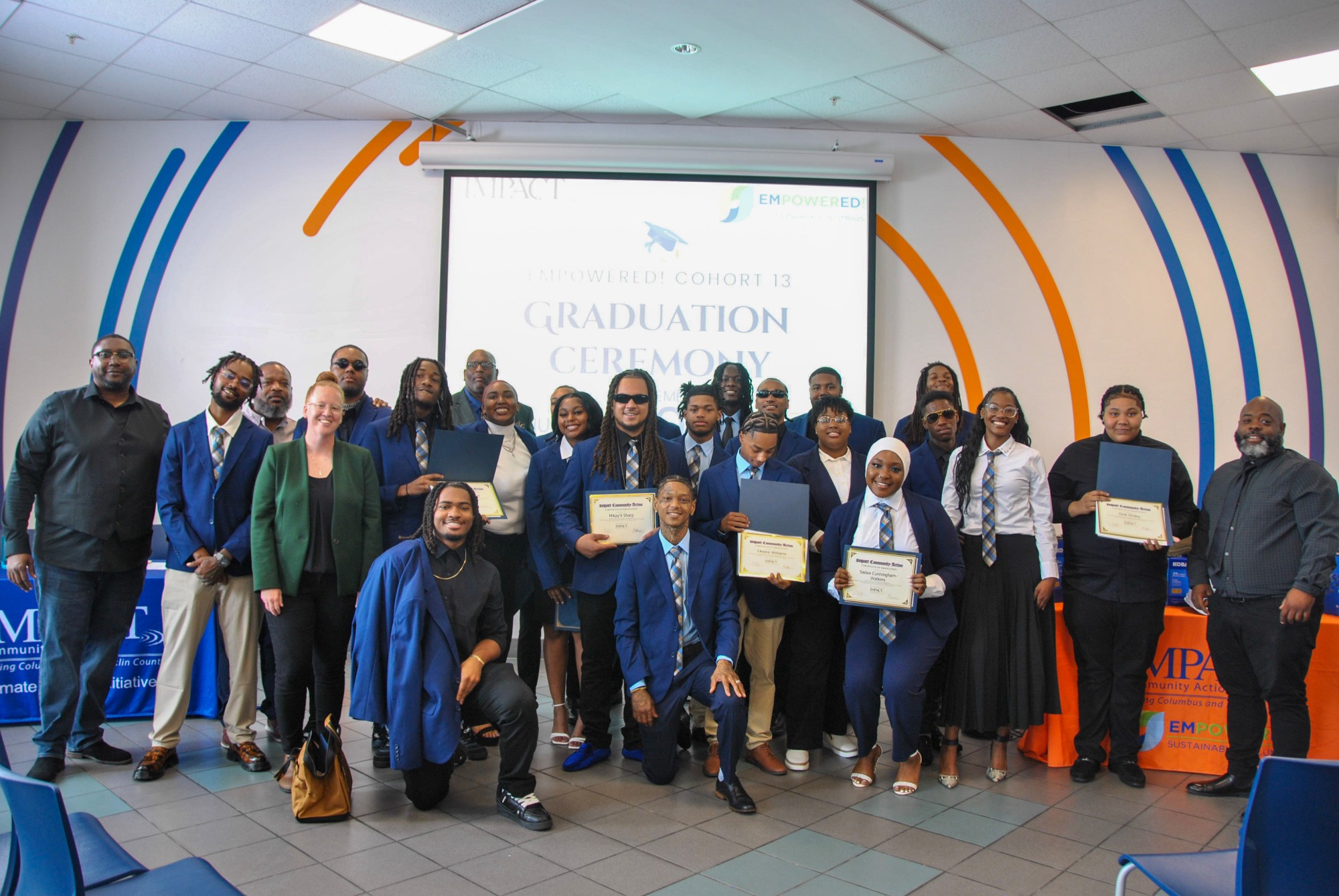 IMPACT Community Action's EMPOWERED! Cohort 13 graduates celebrating at their Columbus graduation ceremony